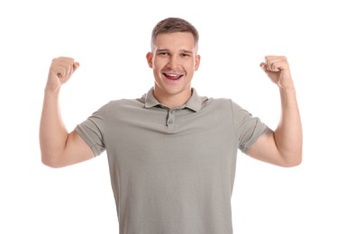 Photo of Happy winner showing his biceps on white background