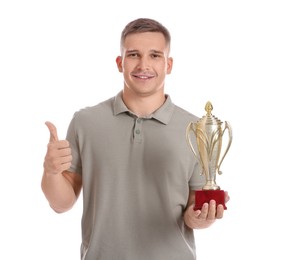 Photo of Happy winner with golden trophy cup showing thumbs up on white background