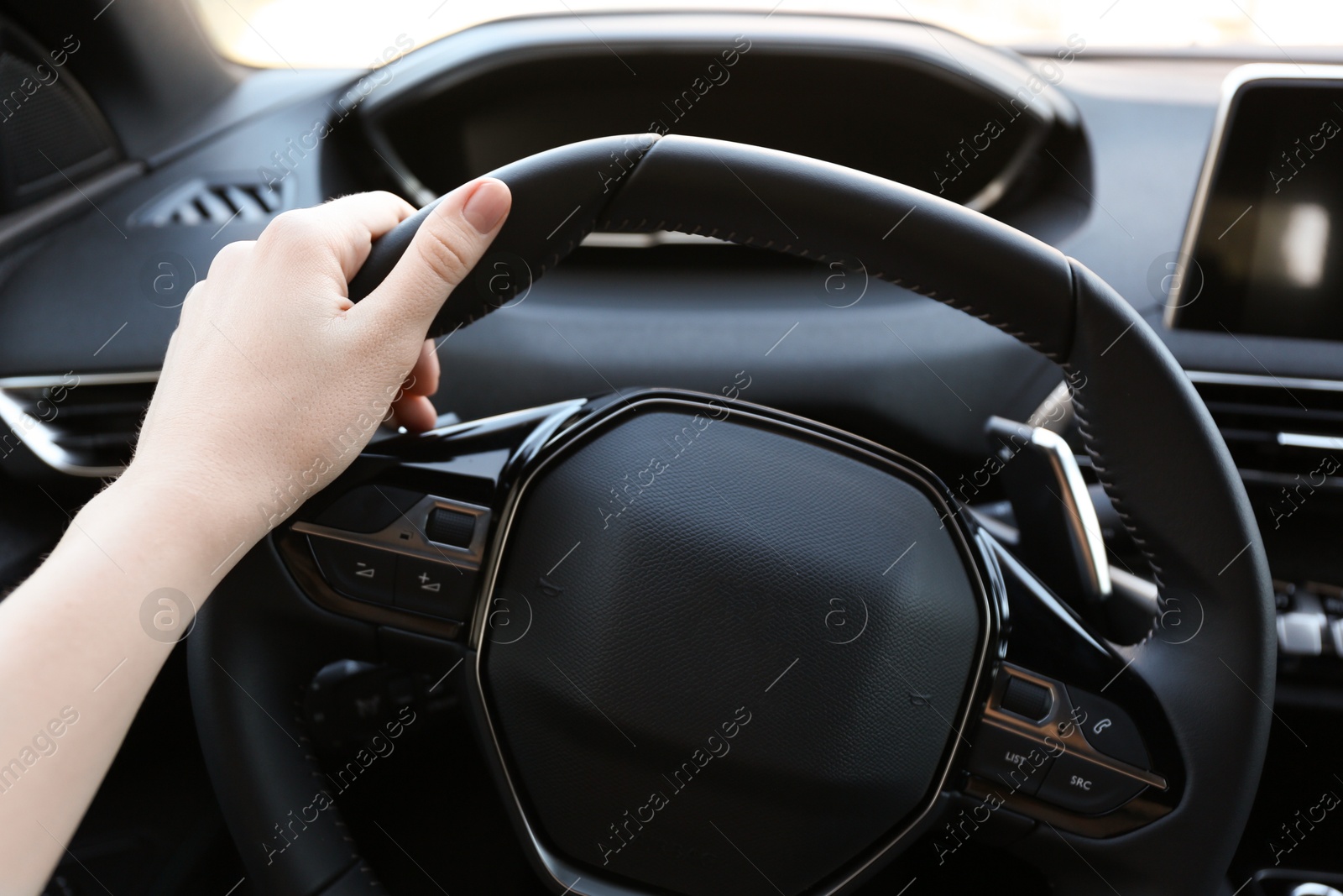 Photo of Woman inside of modern luxury car, closeup view