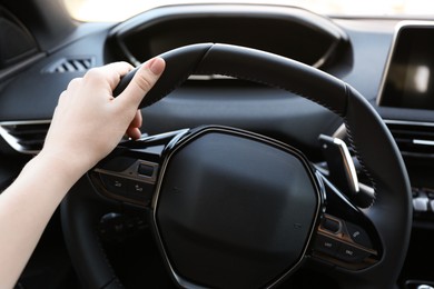 Photo of Woman inside of modern luxury car, closeup view