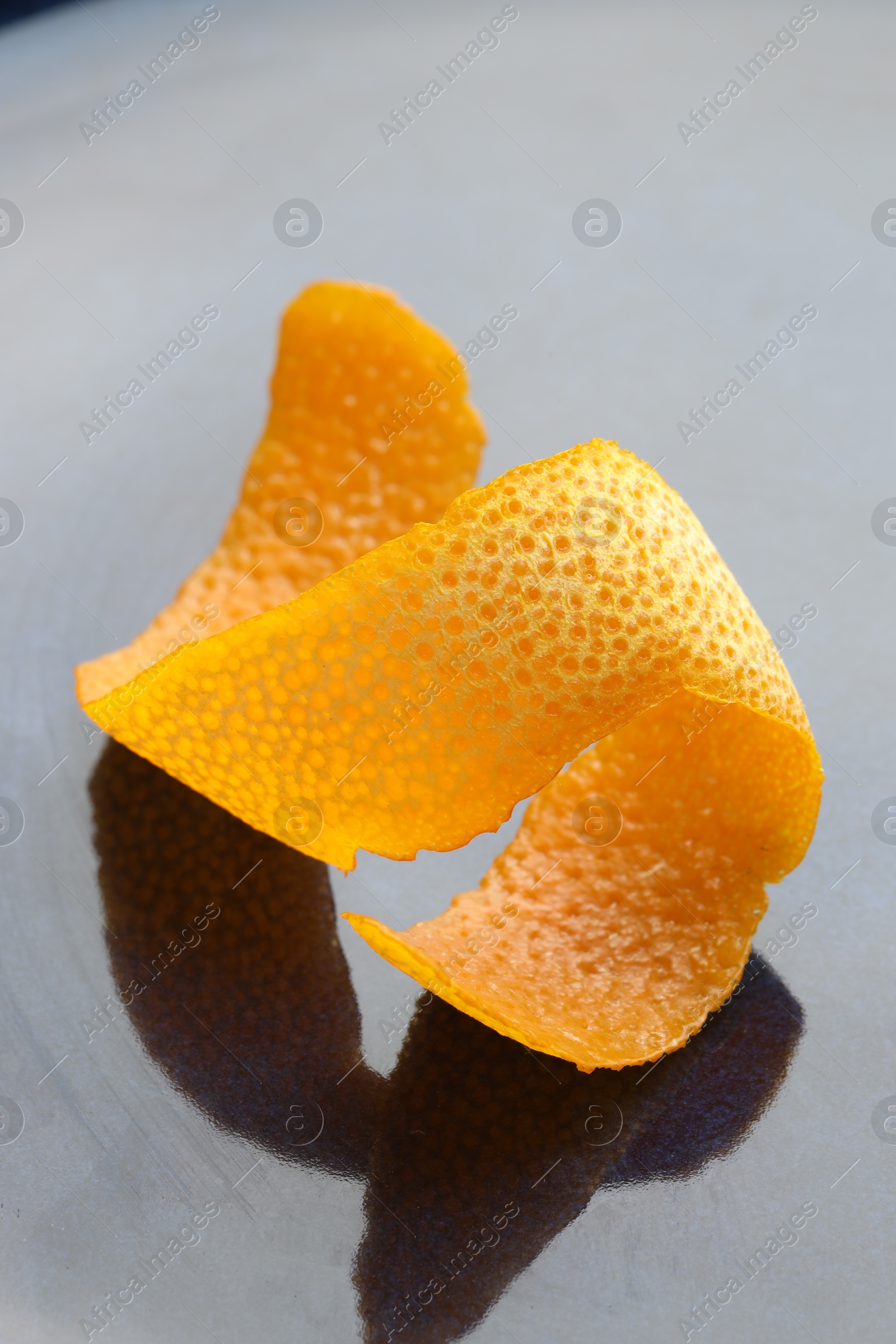 Photo of Fresh orange peel on dark table, closeup