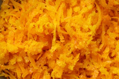 Photo of Fresh orange zest as background, closeup view