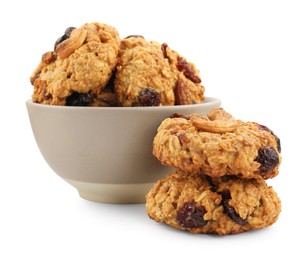 Photo of Delicious oatmeal cookies with dried cranberries and nuts in bowl isolated on white