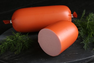 Photo of Tasty boiled sausages and dill on table, closeup