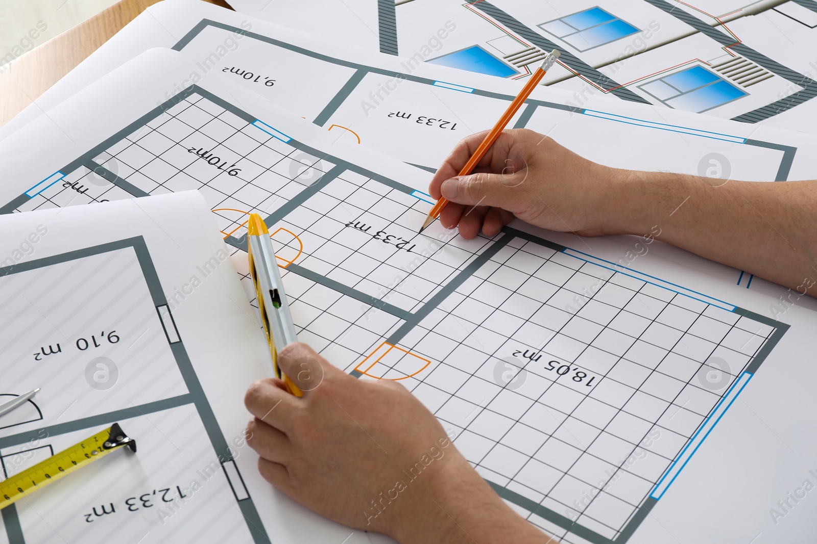 Photo of Architect working with project at table in office, closeup