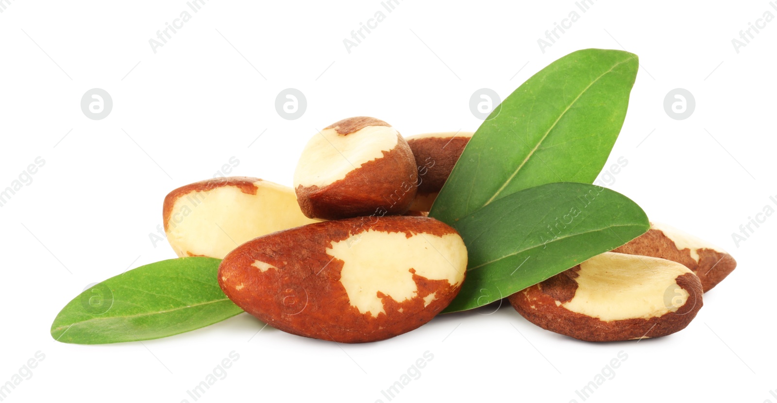 Photo of Tasty Brazil nuts with green leaves isolated on white