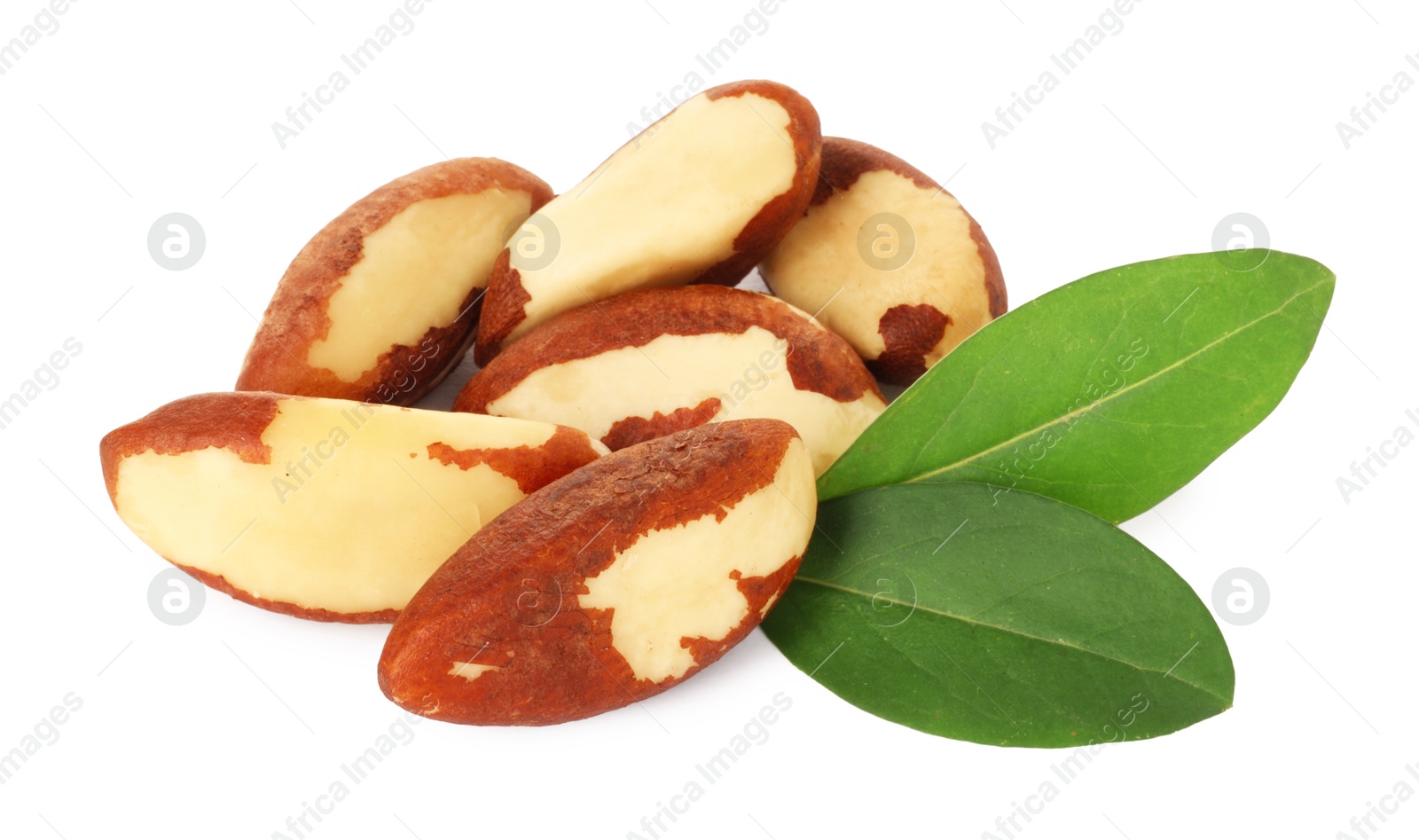 Photo of Tasty Brazil nuts with green leaves isolated on white