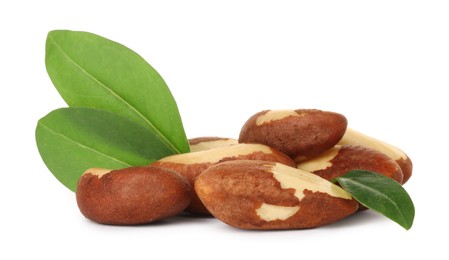 Photo of Tasty Brazil nuts with green leaves isolated on white