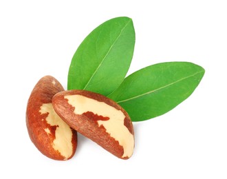 Photo of Tasty Brazil nuts with green leaves isolated on white