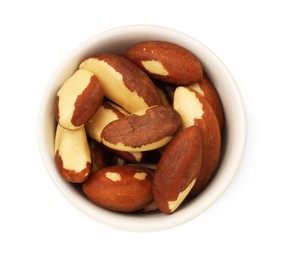 Photo of Tasty Brazil nuts in bowl isolated on white, top view