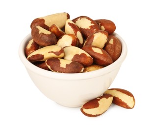 Photo of Tasty Brazil nuts in bowl isolated on white