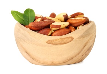 Photo of Tasty Brazil nuts and green leaves in bowl isolated on white