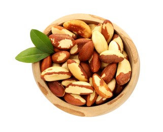 Photo of Tasty Brazil nuts and green leaves in bowl isolated on white, top view