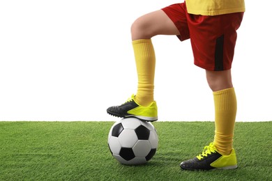 Photo of Football player with soccer ball on artificial grass against white background, closeup