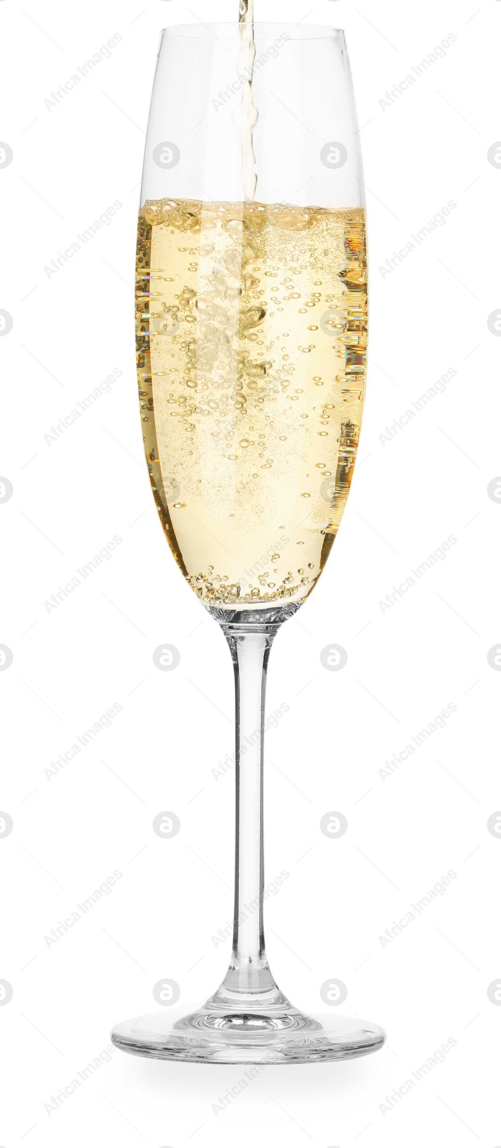 Photo of Pouring champagne into glass isolated on white