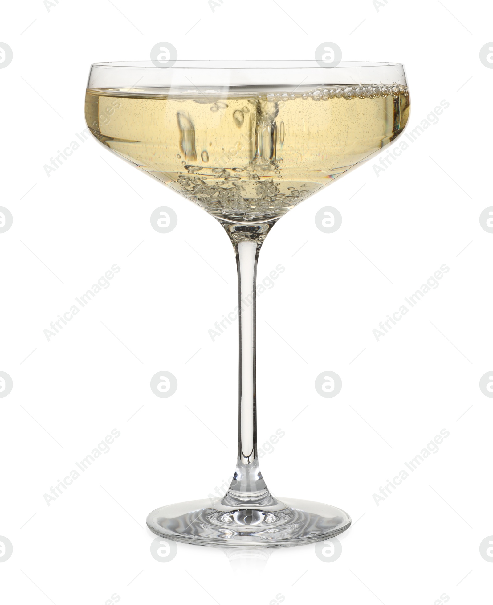 Photo of Pouring champagne into glass isolated on white