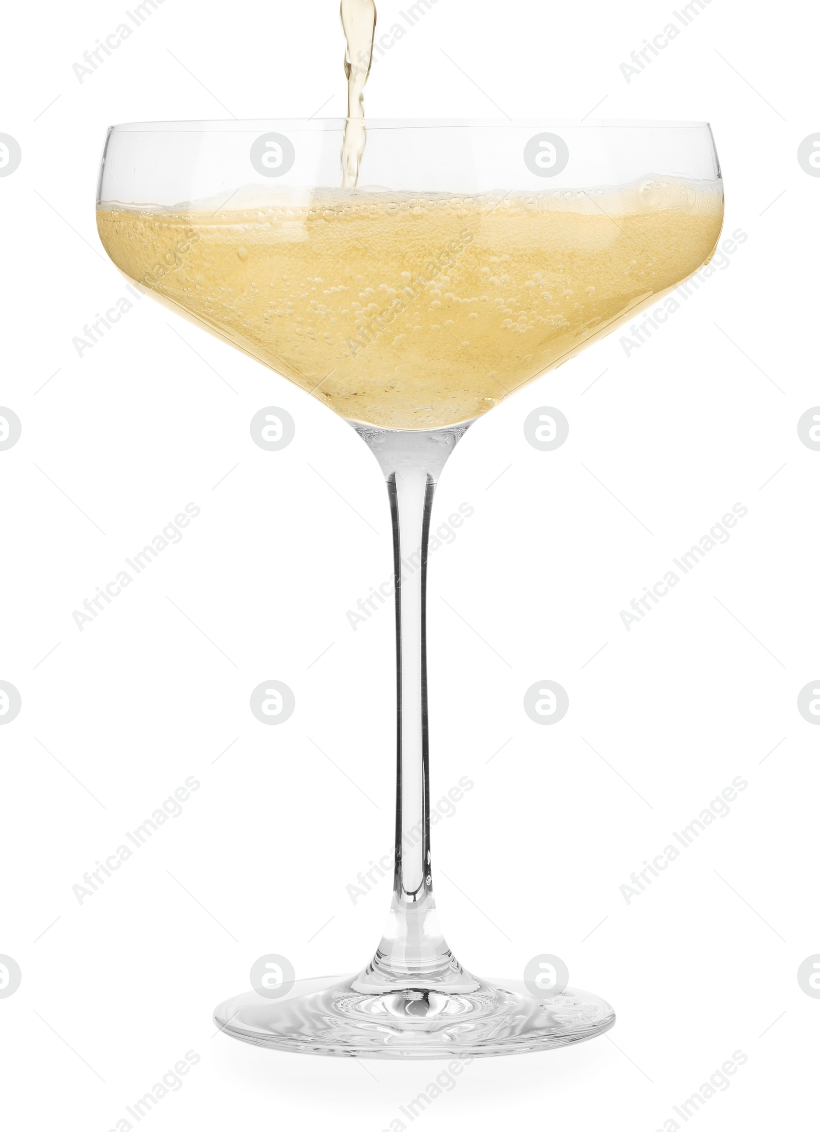 Photo of Pouring champagne into glass isolated on white