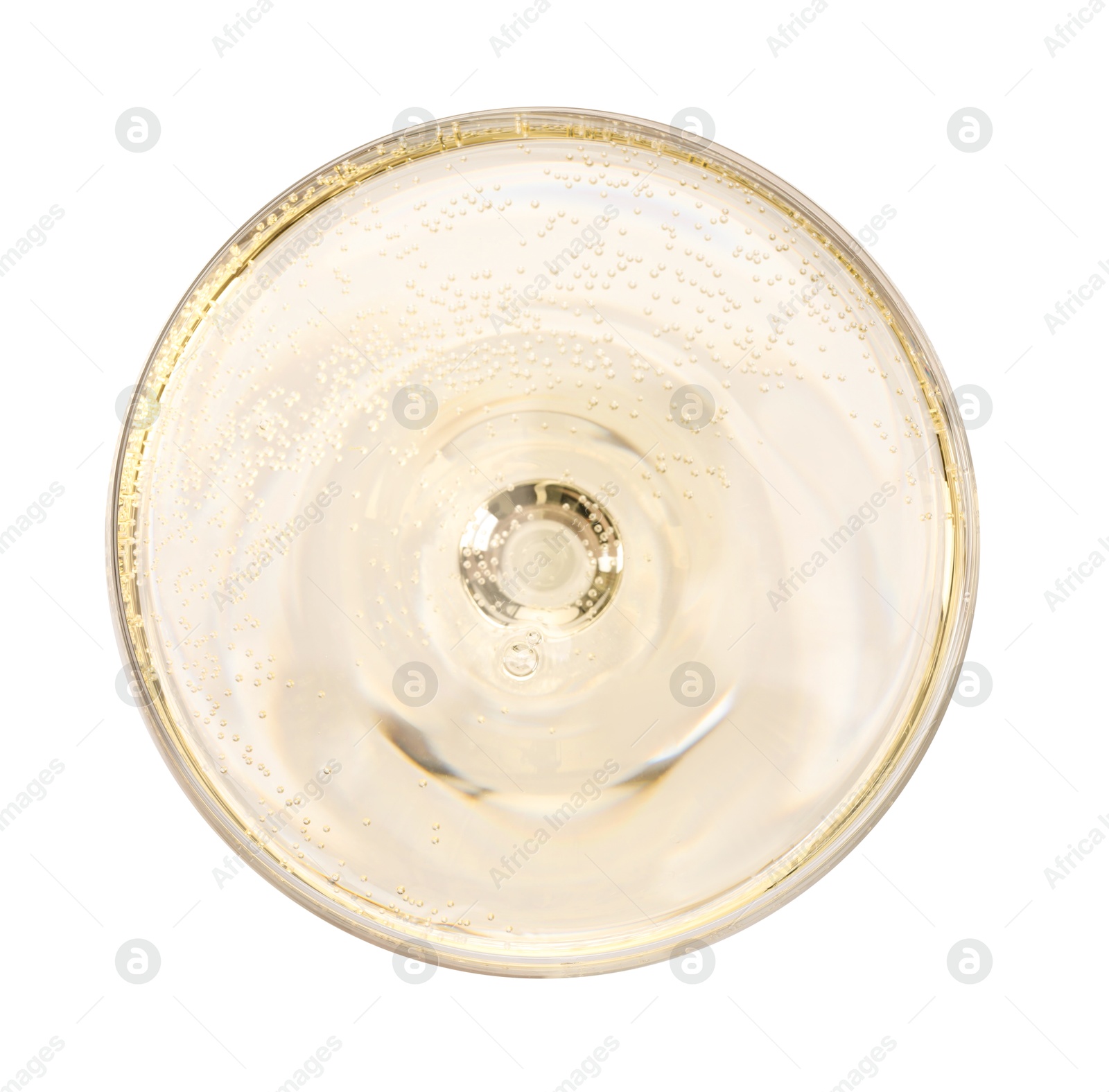 Photo of Champagne in glass isolated on white, top view