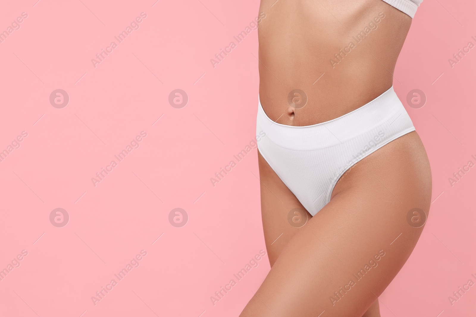 Photo of Woman with perfect skin on pink background, closeup and space for text. Body care