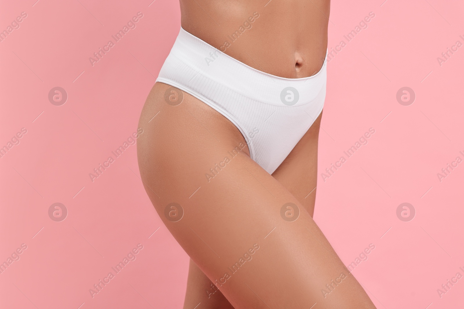 Photo of Woman with perfect skin on pink background, closeup. Body care