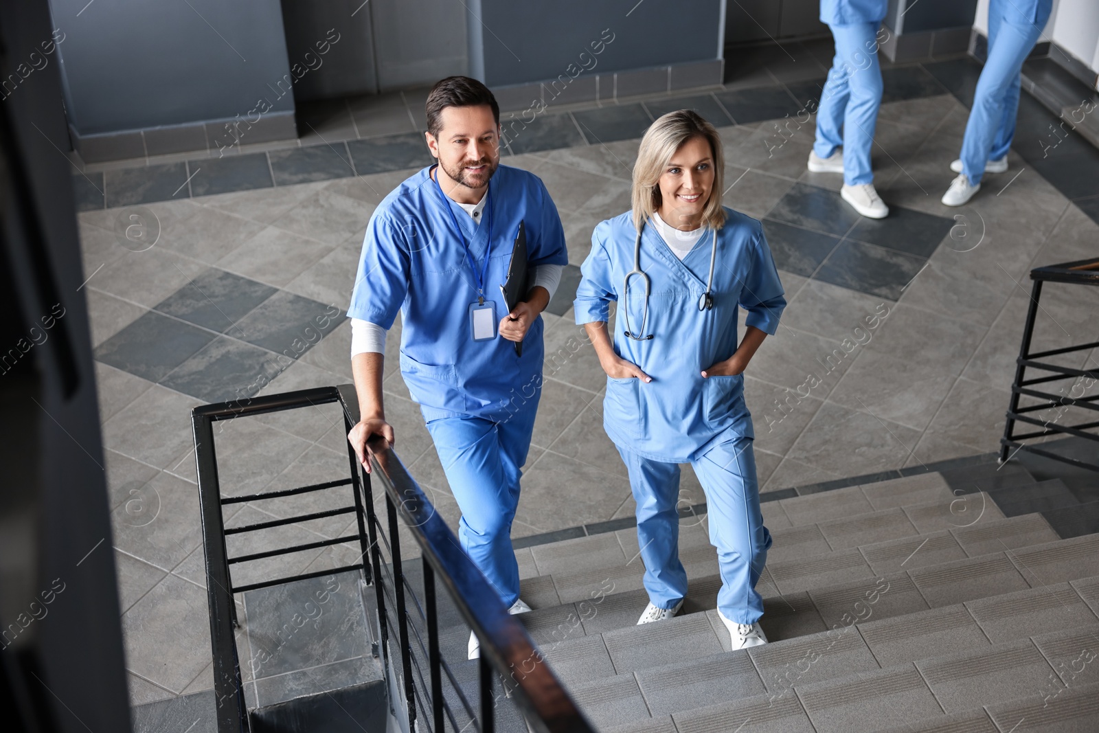 Photo of Healthcare workers walking up stairs in hospital