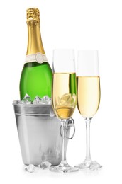 Photo of Champagne and bucket with ice isolated on white