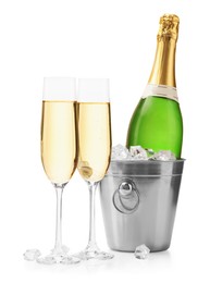 Photo of Champagne and bucket with ice isolated on white