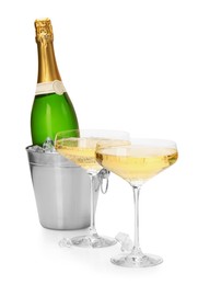 Photo of Champagne and bucket with ice isolated on white