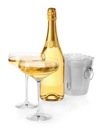 Photo of Champagne and bucket with ice isolated on white