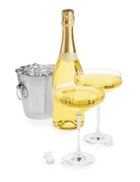 Photo of Champagne and bucket with ice isolated on white