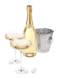 Photo of Champagne and bucket with ice isolated on white