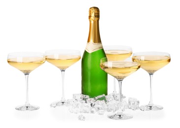 Photo of Bottle and glasses of champagne with ice cubes isolated on white