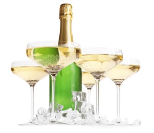 Photo of Bottle and glasses of champagne with ice cubes isolated on white