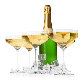 Photo of Bottle and glasses of champagne with ice cubes isolated on white