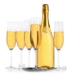 Photo of Bottle and glasses of champagne with ice cubes isolated on white