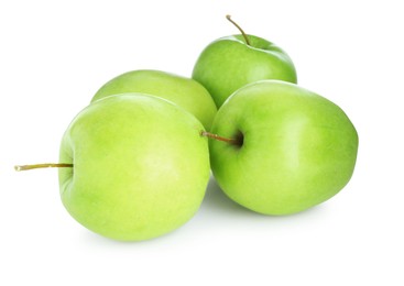 Photo of Many fresh green apples isolated on white