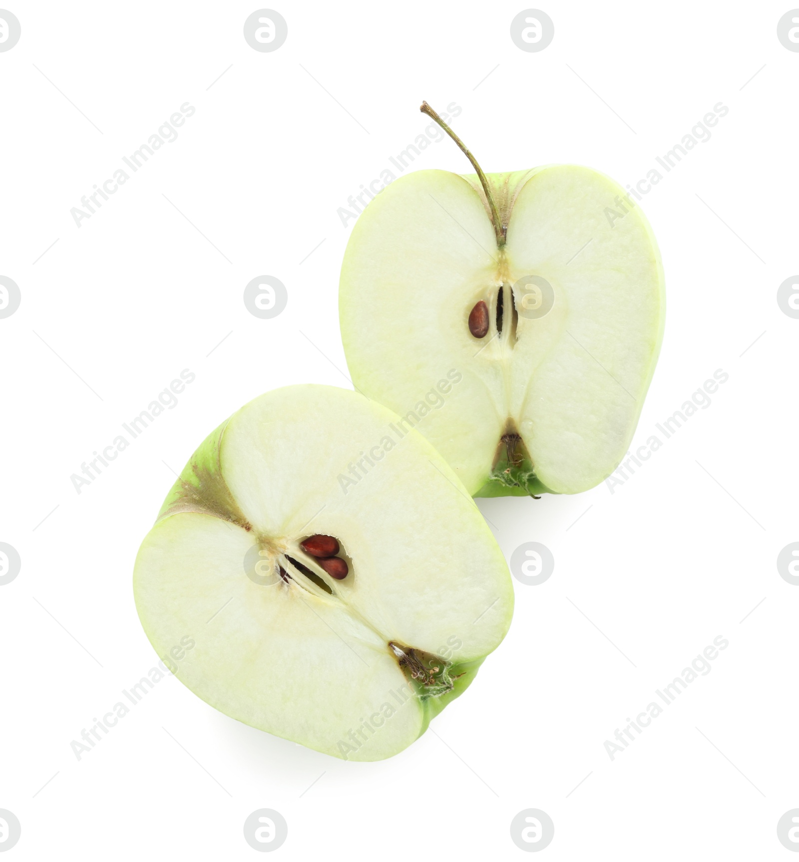 Photo of Halves of green apple isolated on white, top view