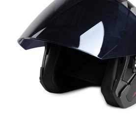 Photo of Modern motorcycle helmet with visor on light background, closeup