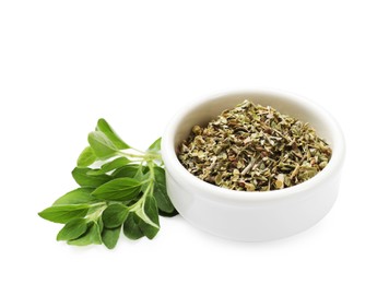 Photo of Dried oregano in bowl and green leaves isolated on white