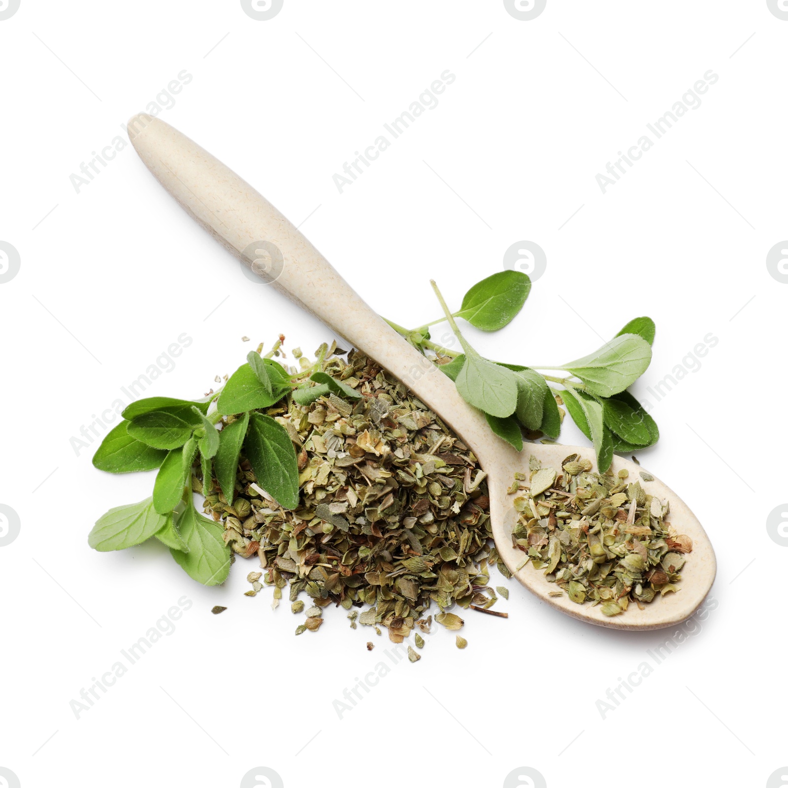 Photo of Dried oregano, green leaves and spoon isolated on white