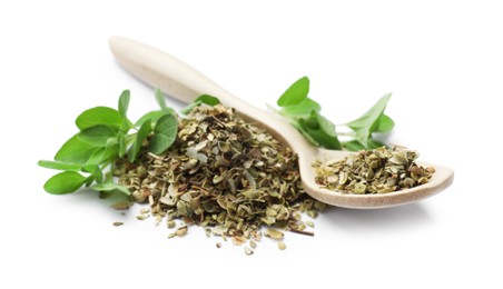 Photo of Dried oregano, green leaves and spoon isolated on white