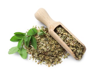 Photo of Dried oregano, green leaves and wooden scoop isolated on white