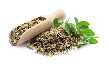 Photo of Dried oregano, green leaves and wooden scoop isolated on white