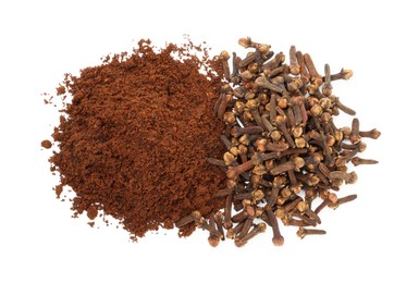 Photo of Pile of clove powder and dried buds on white background, top view. Aromatic spice