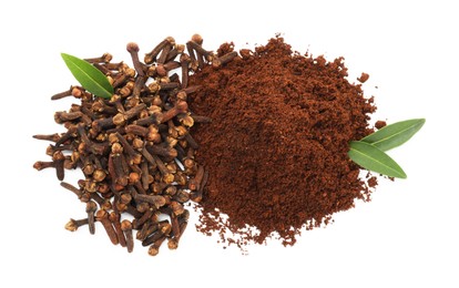 Pile of clove powder, dried buds and green leaves on white background, top view. Aromatic spice