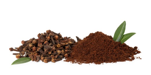 Photo of Pile of clove powder, dried buds and green leaves on white background. Aromatic spice