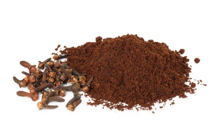 Pile of clove powder and dried buds on white background. Aromatic spice