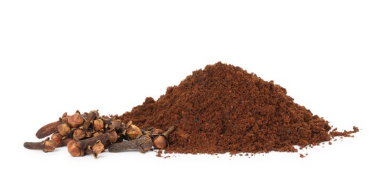 Pile of clove powder and dried buds on white background. Aromatic spice