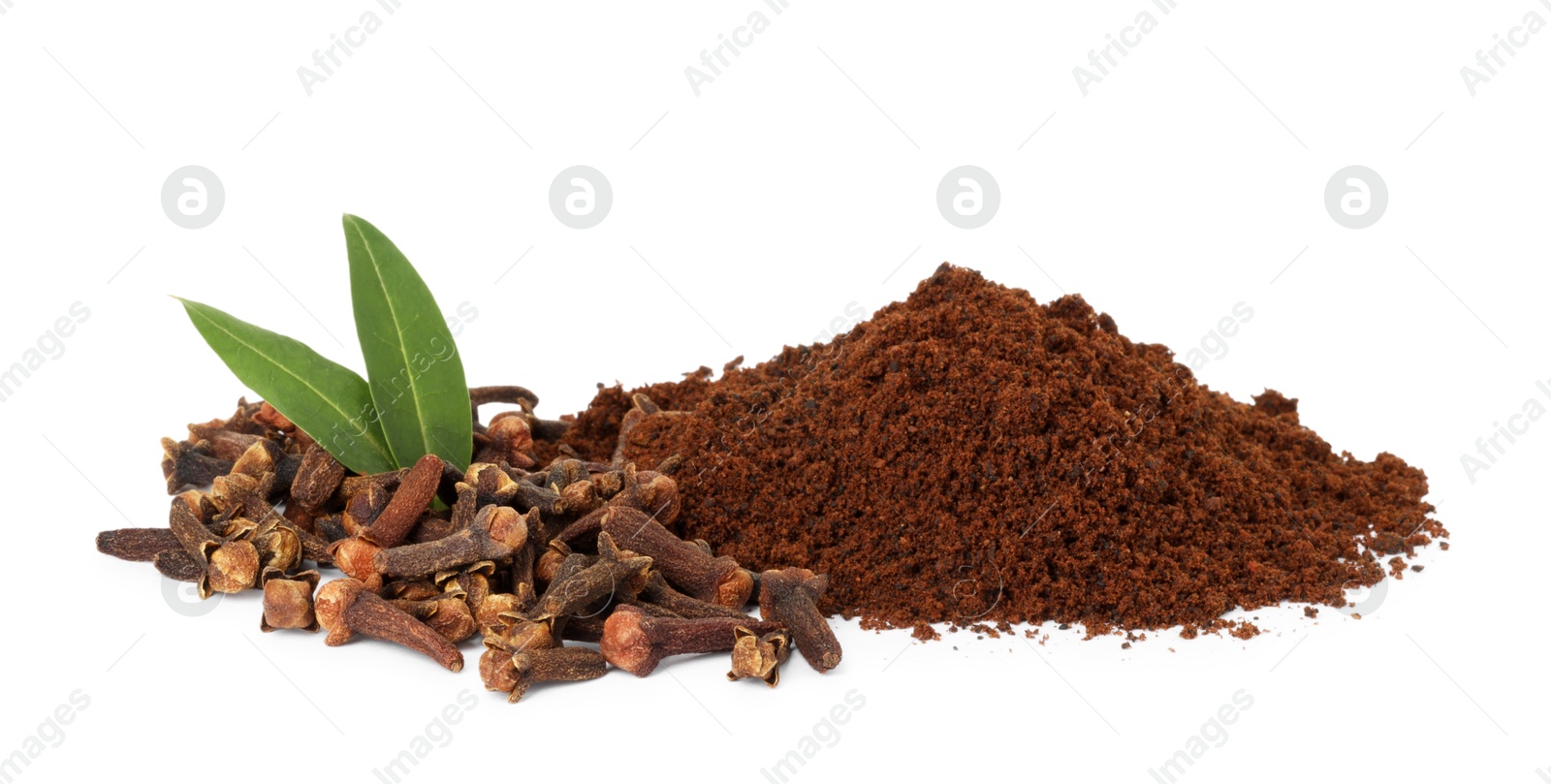 Photo of Pile of clove powder, dried buds and green leaves on white background. Aromatic spice