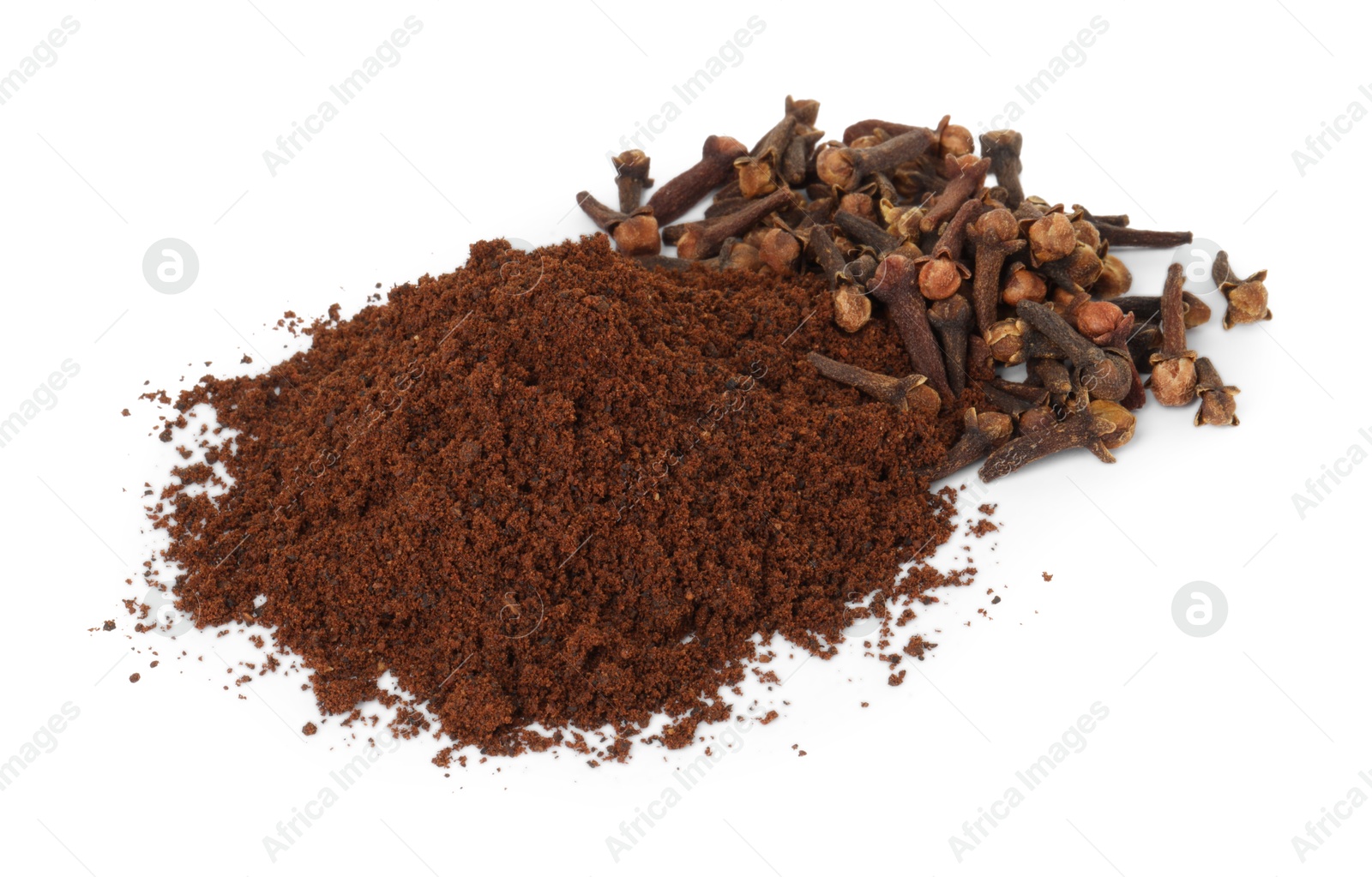 Photo of Pile of clove powder and dried buds on white background. Aromatic spice